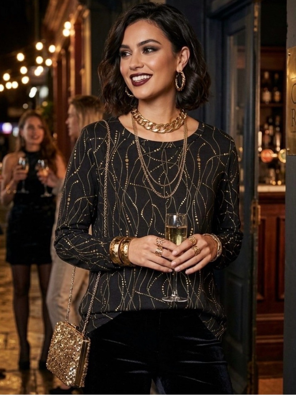 Elegant Black and Gold Embossed Long-Sleeve Top